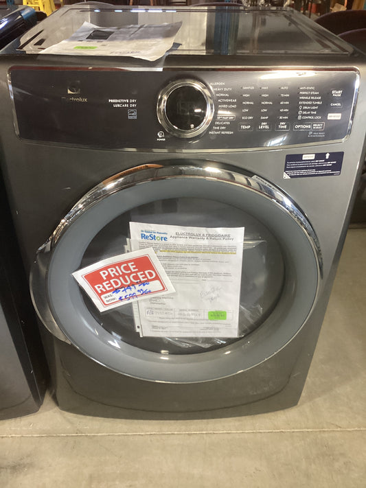 A dryer with a sign on it indicating there is a discount on the price of the item.