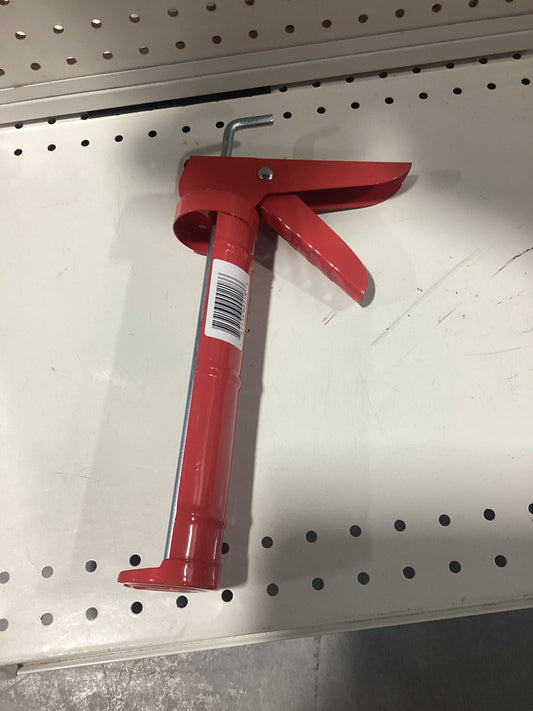 A red tool displayed on a store shelf.