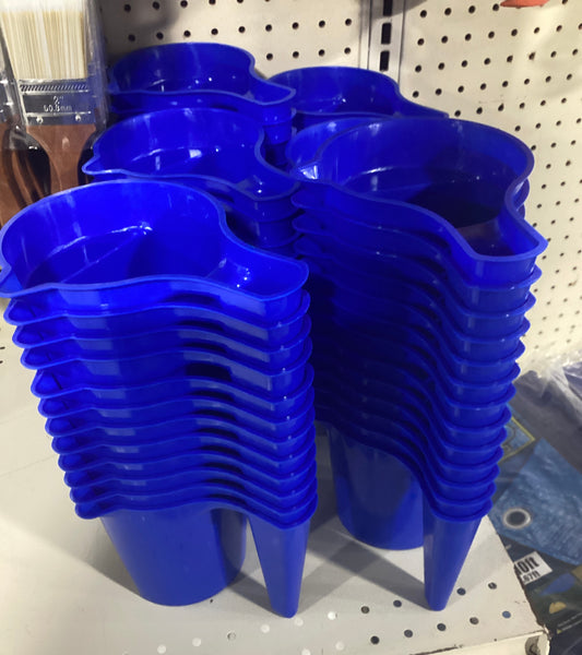 Blue plastic cups neatly arranged on a store shelf.