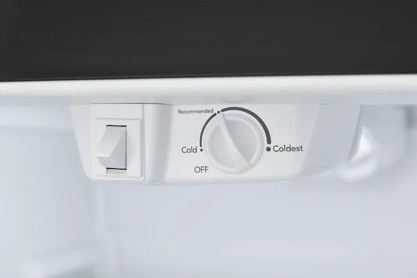 A close-up of a refrigerator with a control panel.