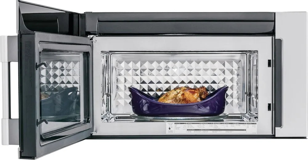 A microwave oven with a chicken inside, ready to be cooked.