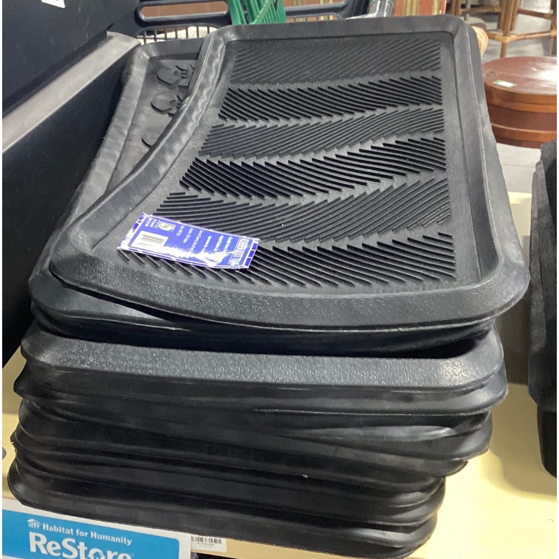 Boot trays: a rectangular tray with raised edges used to hold wet or dirty boots, preventing dirt and water from spreading indoors.