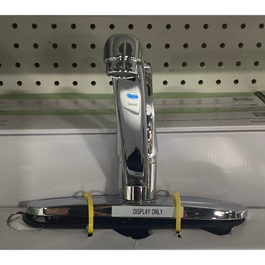 A chrome faucet with a yellow strap on a shelf.