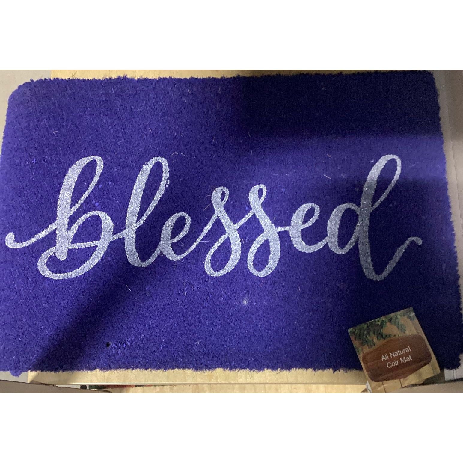 Blue mat that reads "blessed"